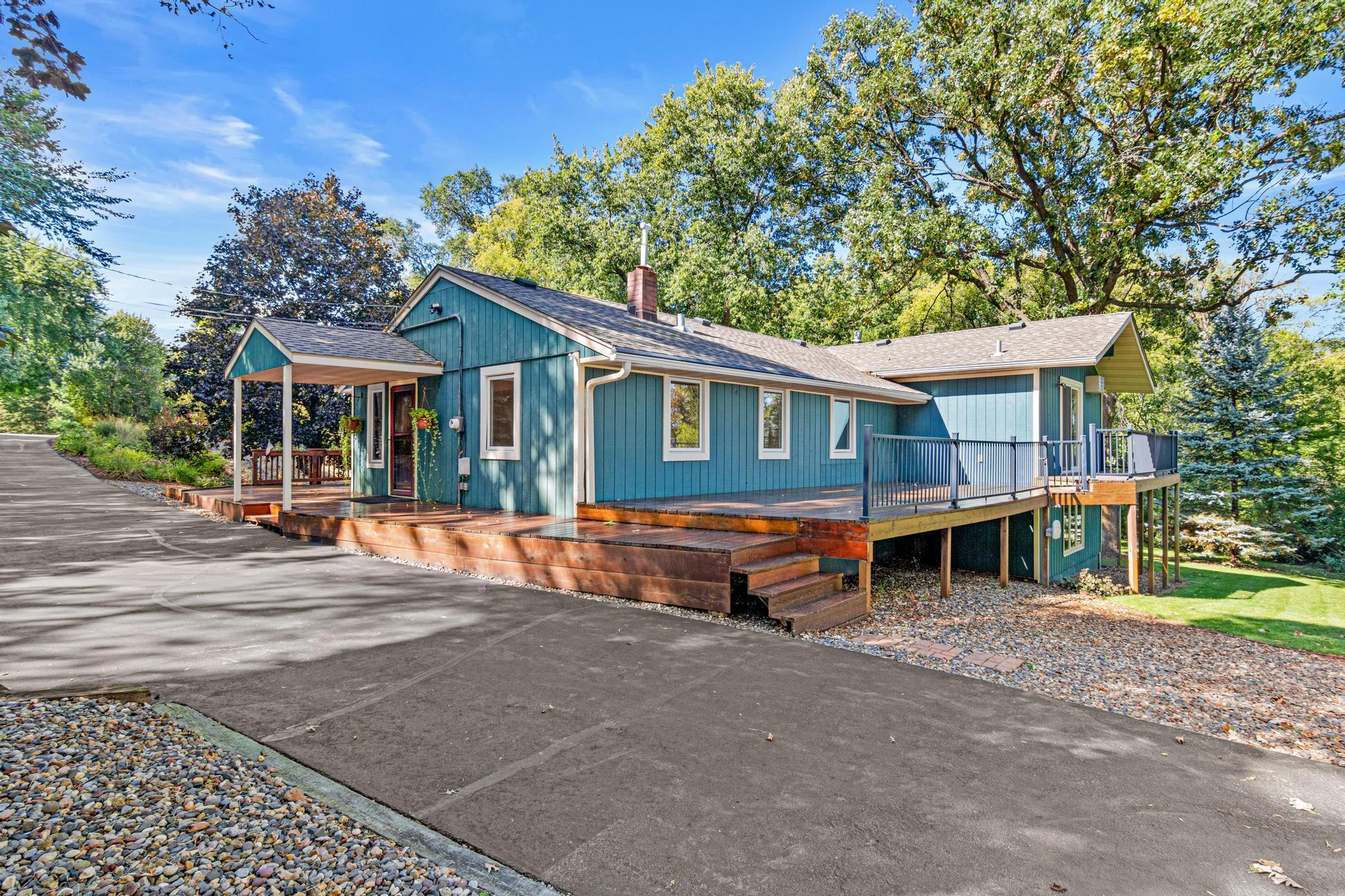 Wrap around deck allows you to enjoy views from almost every angle of the home. The driveway was just resealed and allows for multiple cars to be parked on it.