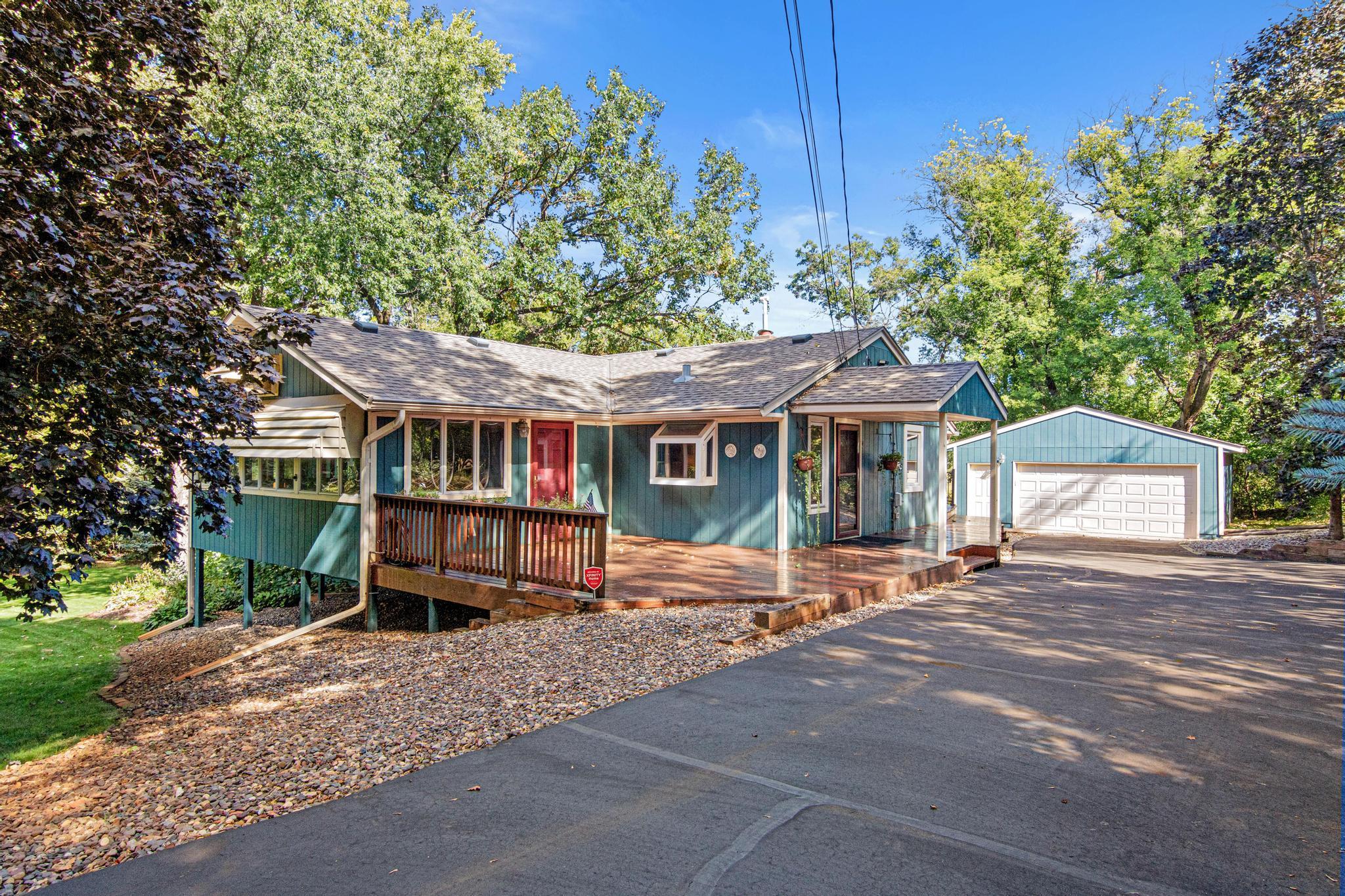 Fantastic 4 bedroom/3-bathroom home in Vadnais Heights and the Mounds View School District. Oversized four season porch has windows on three sides and brings the outdoors in. Large deck is perfect for outdoor entertaining.