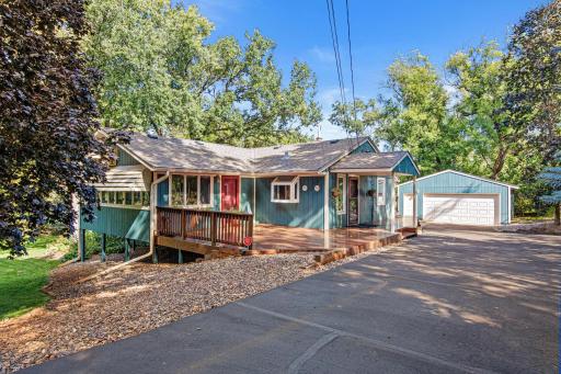 Fantastic 4 bedroom/3-bathroom home in Vadnais Heights and the Mounds View School District. Oversized four season porch has windows on three sides and brings the outdoors in. Large deck is perfect for outdoor entertaining.