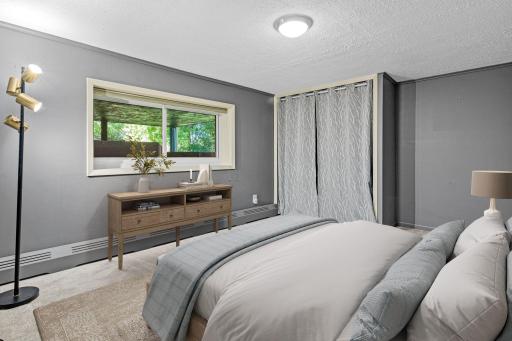The fourth bedroom is located in the lower level. Perfect for friends or family that are visiting. Visually staged.