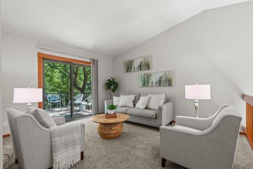 Upper level living room with access to the deck