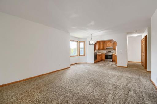 Open upper level floorplan with living room, dining room that are open to the kitchen.