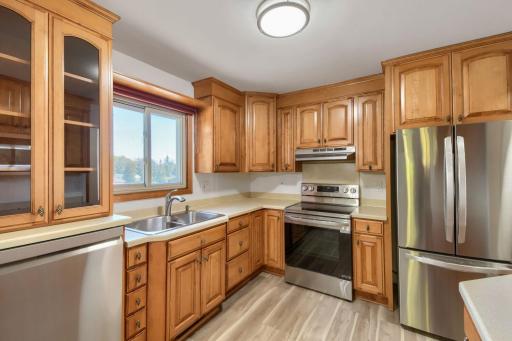 Beautifully updated kitchen with lovely cabinetry, new stainless steel appliances and new flooring.