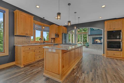 With Soaring Vaulted Ceilings And Open Lake Views, The Living Room Flows Seamlessly From The Kitchen To Offer An Additional Gathering Space!