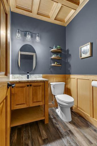 Beautifully Appointed, The Main-Level Bath Showcases Exceptional Craftsmanship With Refined Wainscoting And An Architectural Coffered Ceiling!