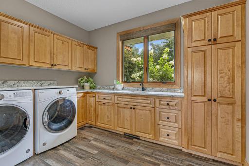 Bright And Sunny MAIN FLOOR Laundry, New Floors, Fresh Paint, Amazing Custom Built Cabinets And Built In Sink!!