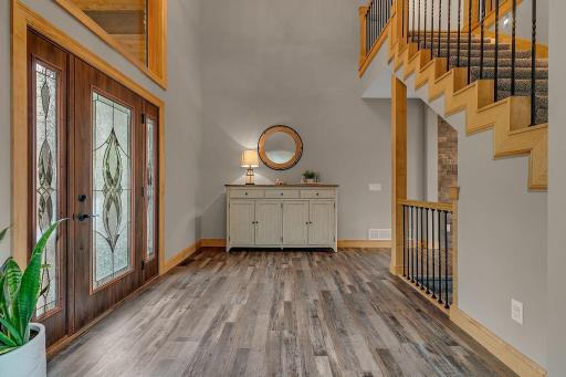A Very Spacious Entry Way With Open Views To The Upper And Lower Levels And Complete With Walk Ways Into Both The Kitchen And Living Area!