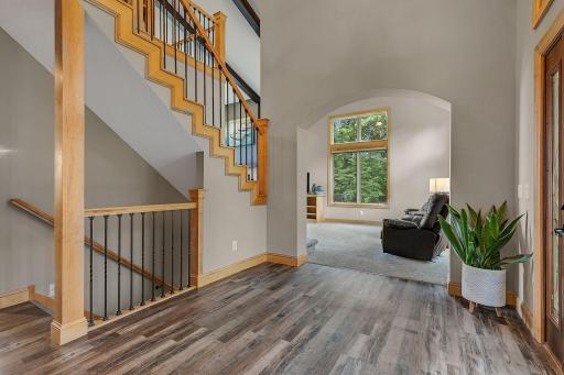 Step Inside To Find This Very Spacious Foyer With Amazing Arched Views Into The Main Level Living Room!