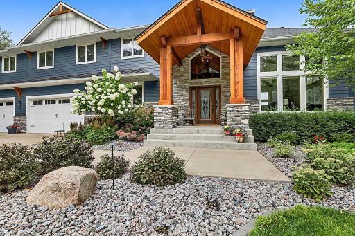 UPDATED WITH WINDOWS, SIDING, ROOF! The Natural Warmth Of The Rich Wood Creates A Grand Yet Intimate Canopy Welcoming You In!