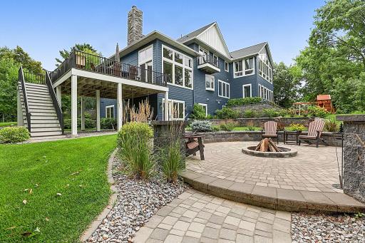 Perched Top-of-the-World: Unmatched privacy, serene surroundings, and panoramic vistas. This Back Yard Is Sure To Elevate Your Lake Life And Provide A 10+ Experience!!
