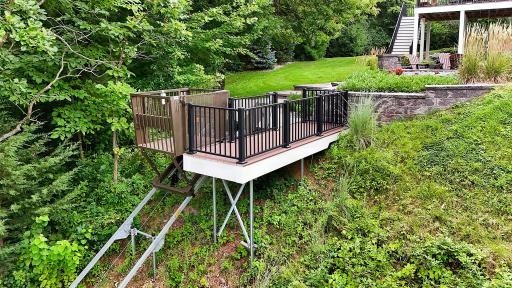 A Newly Installed Custom Lake Elevator Takes The Work Out Of Lake Life, Transporting Passengers And Gear Down To The Water Effortlessly!