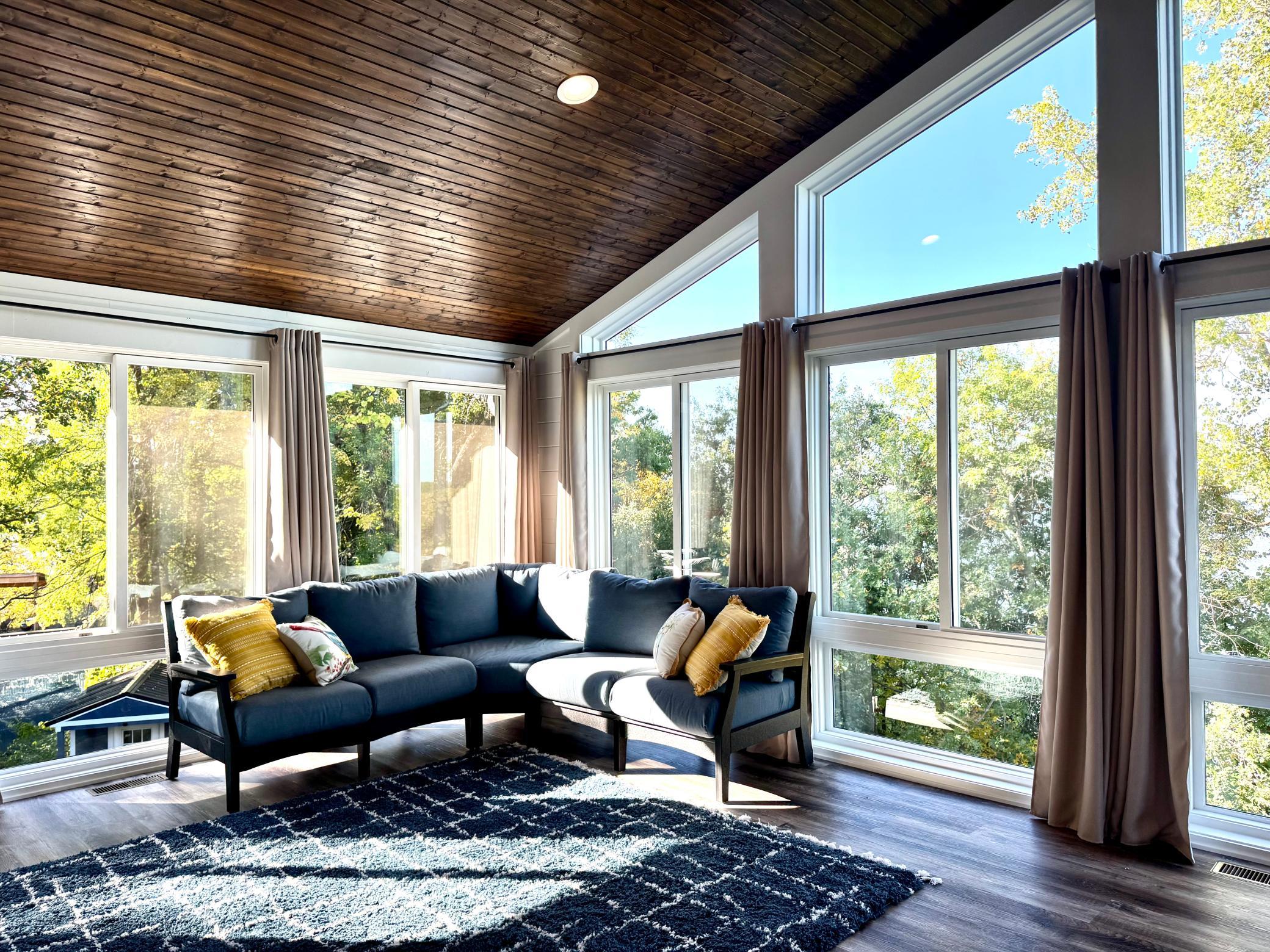 Step seamlessly from primary suite into an expansive four-season sunroom framed by tranquil lake views. Whether taking in quiet morning sunrises or unwinding in the evening, this sunlit sanctuary perfectly pairs everyday comfort with stunning water!