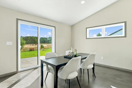 Nice dining space with sliding patio door that leads out to the patio