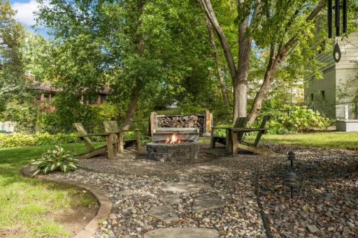 This fenced yard glows at night with the landscape lighting and privacy.