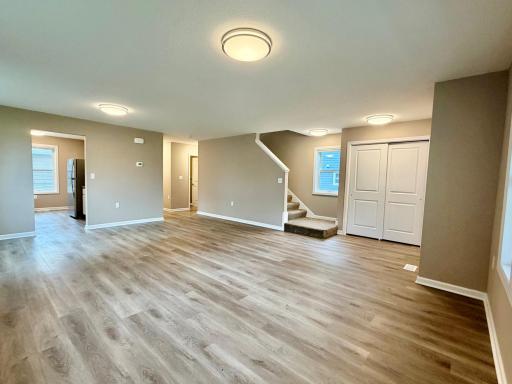 Living/dining room, showing entry to kitchen and full bath.