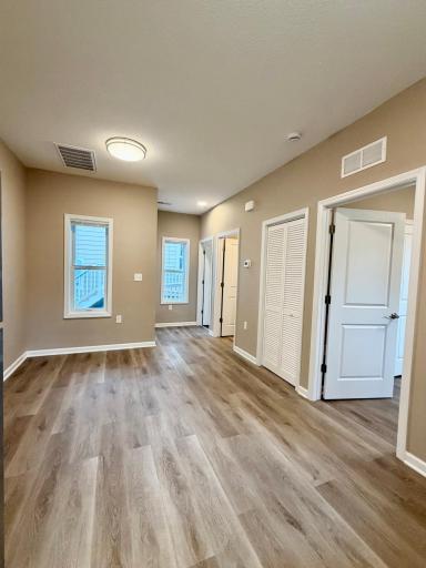 View showing doors to mechnical room, bathroom, laundry closet and bedroom.