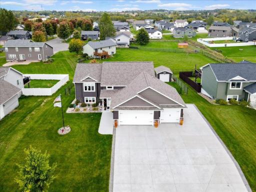 Very large concrete driveway with additional parking areas for RV, trailers