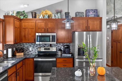 Stylish backsplash and stainless steel appliances at 366 Bluebill St