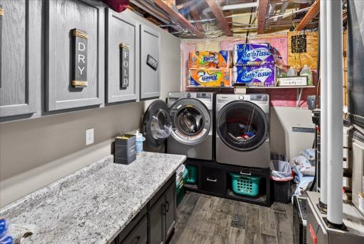 Laundry Room/Utility space with cabinets and folding counter space
