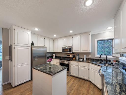 Stainless steel appliances in this kitchen with a center island!