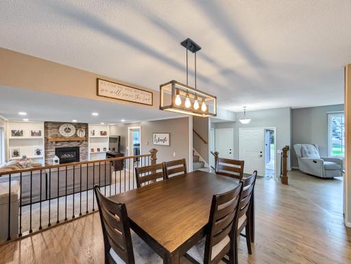 Featuring a brand new, hand-built railing separating this space from the family room.