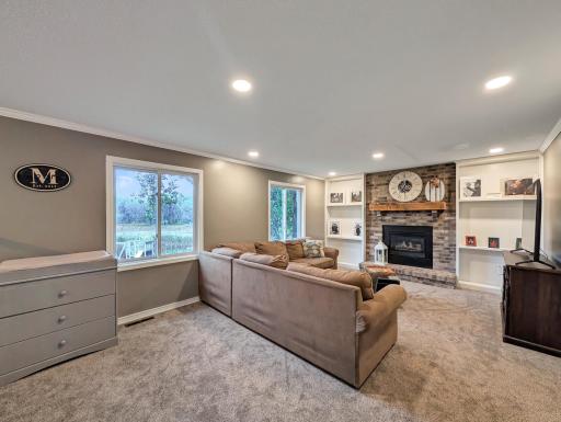 This family room stays bright with large windows!