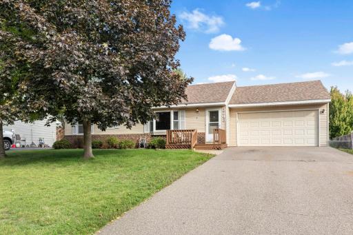 Beautiful curb appeal at sunset! This charming one-level home features an inviting front entry, mature landscaping, and an attached two-car garageâall framed by a picture-perfect evening sky.