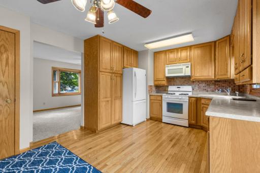 Kitchen features an abundance eof cabinetry and tiled backsplash.