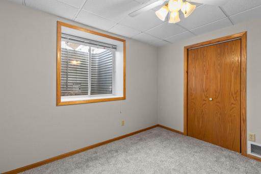 4th bedroom in the lower level with oversized, egress window.
