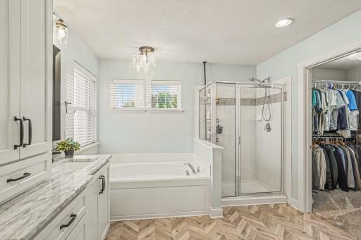 Large soaking tub and separate walk-in closets