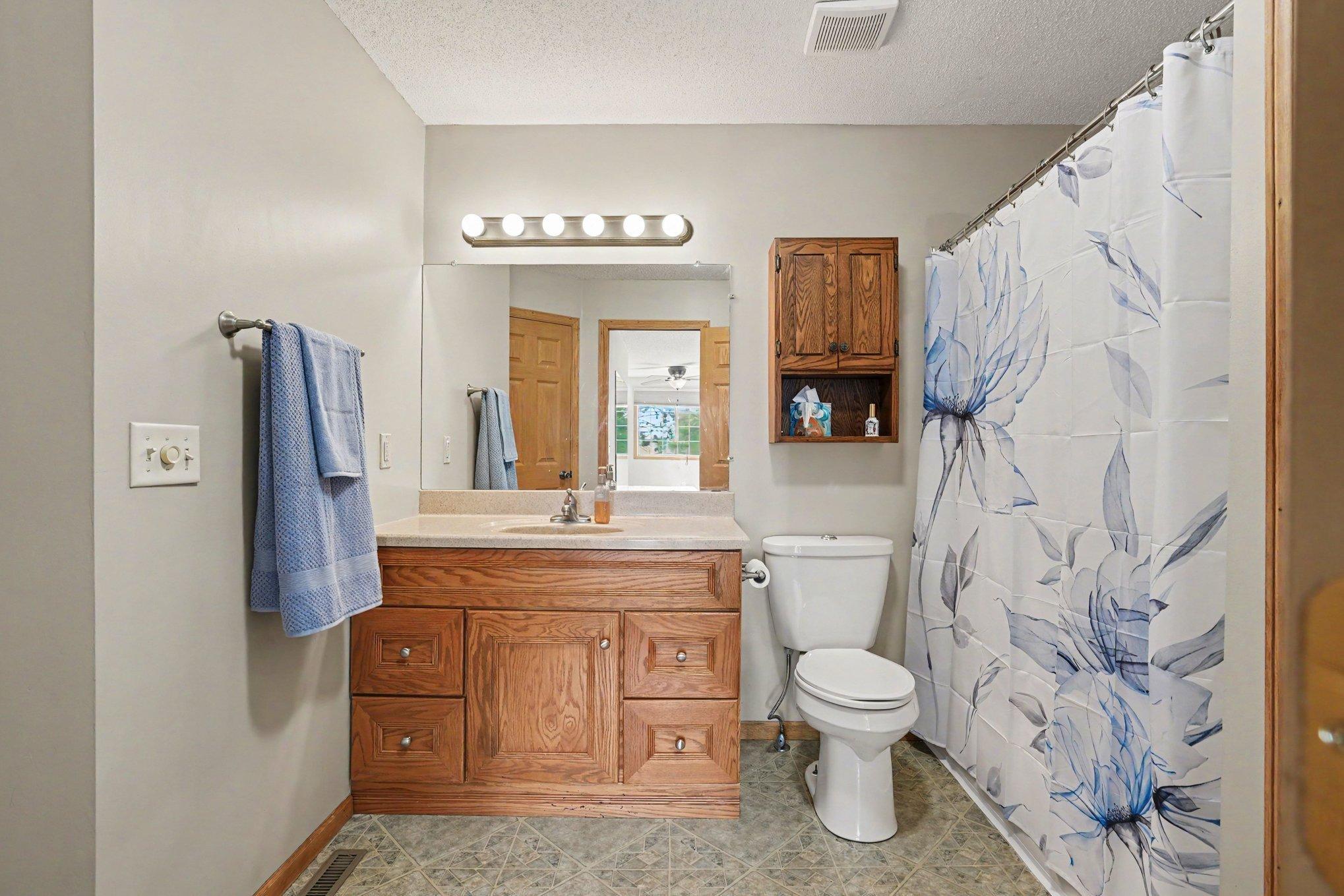 Full Bath With Pass Through Doorway to Primary Bedroom