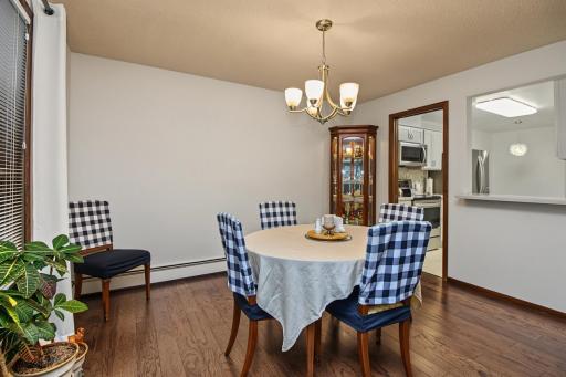 Dining room with hardwood floors conveniently just off the kitchen.