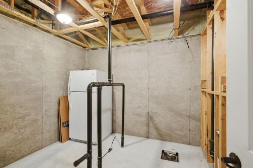 Dedicated space for a future lower-level bathroom is already equipped with existing rough-ins, providing a great head start for finishing the space and adding even more functionality to the lower level.