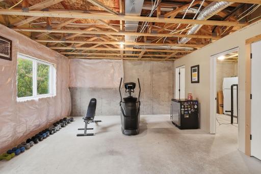 This spacious lower-level area offers excellent potential for a future 5th bedroom, with room to incorporate a generous walk-in closet. Currently used as a workout space, it provides flexibility to finish and customize to fit your needs.