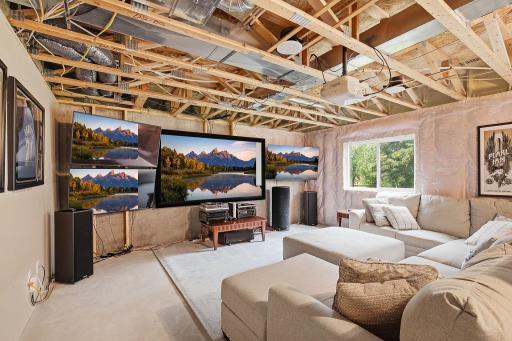 Lower level family room as it is currently. The lower-level also offers 8-foot ceilings and in-floor radiant heat for added comfort.