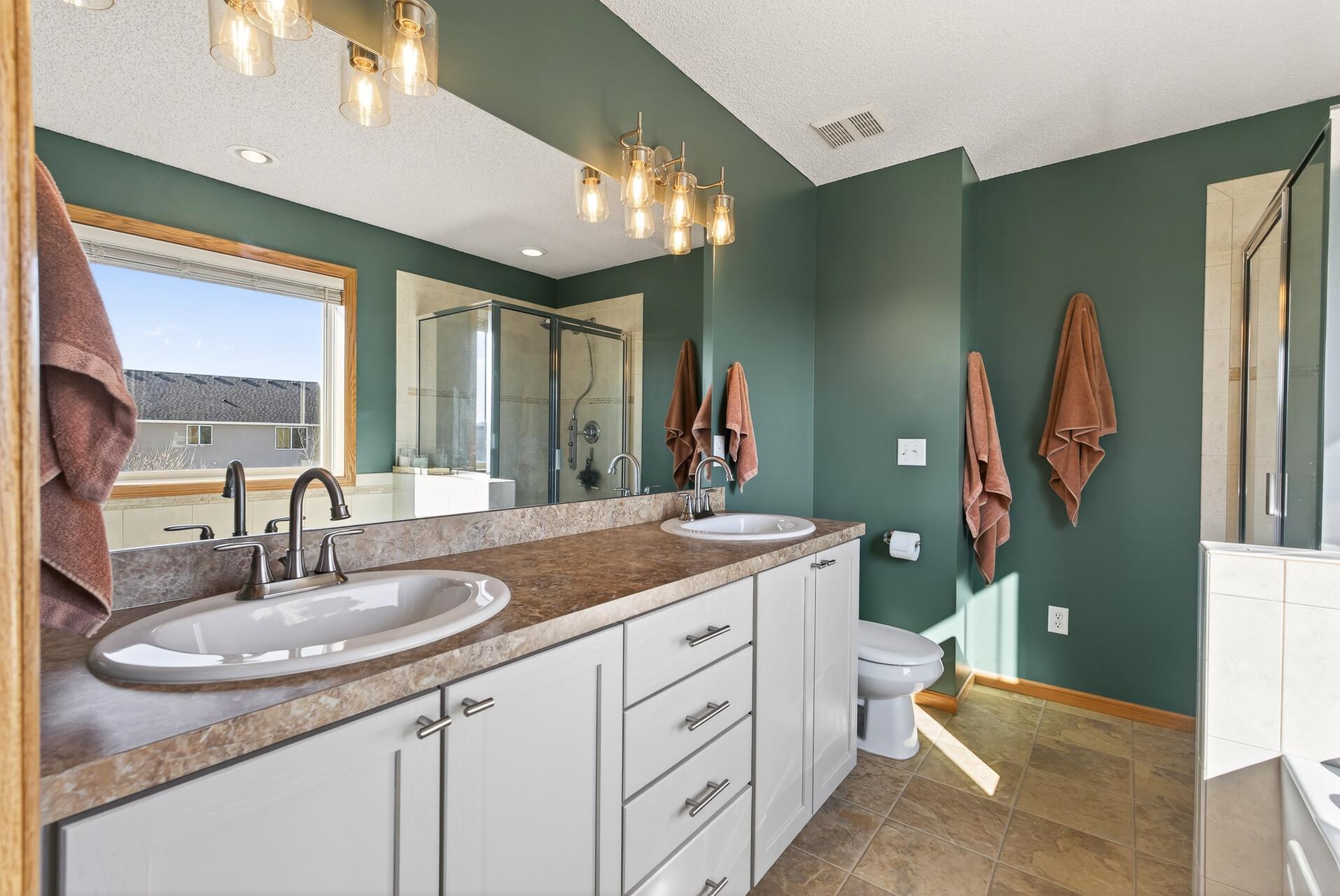 Raised vanity with ample storage space.