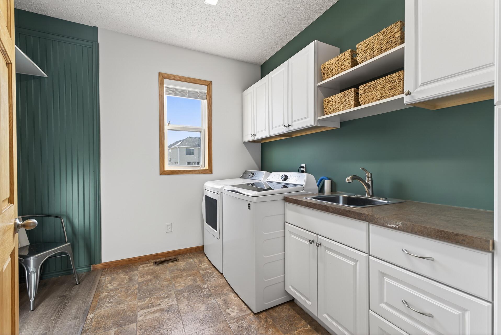 Easy to stay organized with Main Floor Laundry add so much storage!