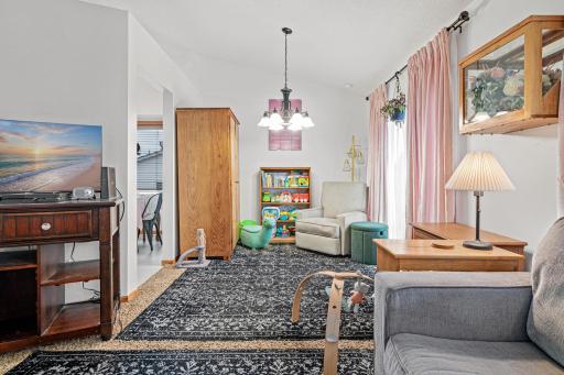 Additional space off of kitchen and living room could be used as a dining room, play room, or even home office space
