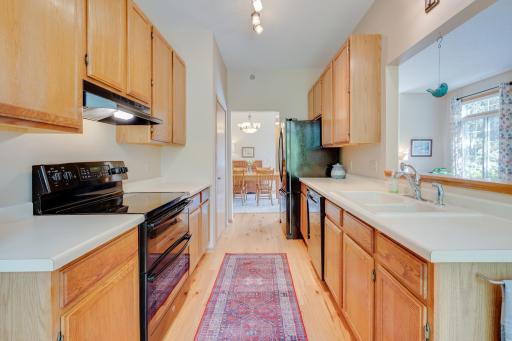 Kitchen conveniently located between the formal dining area and breakfast nook