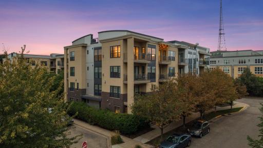 The condo is located in a well-maintained building on a tree-lined street, offering a lovely setting for neighborhood walks.