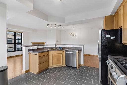 The kitchen features a generous wraparound breakfast bar with seating for up to six.