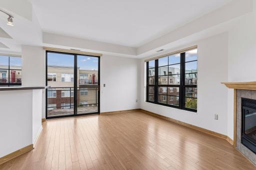 Sliding glass doors lead to the larger of the two covered balcony spaces.