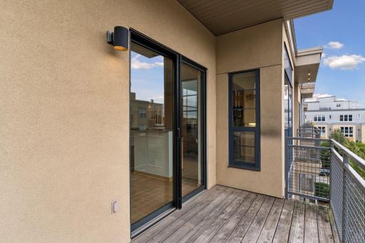 This view highlights the balconyâs generous depth, offering ample space for comfortable seating or outdoor dining.