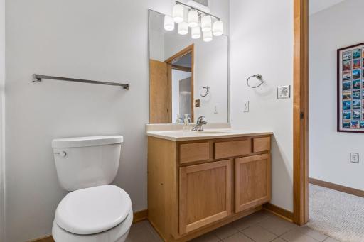 The second bathroom has tile flooring as well as a shower.