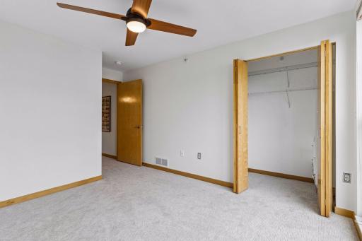 The second bedroom has a ceiling fan and reach-in closet.