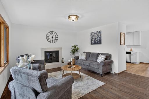 Front living room with refinished hardwood and fireplace