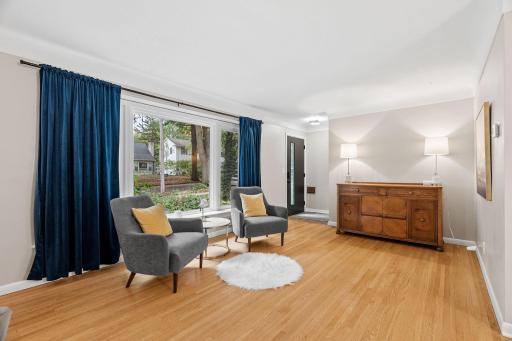 Bright and open main level with picture window and family room space. All new windows throughout the home in 2023.