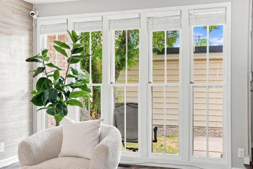 Floor-to-ceiling windows bring beautiful natural light into the main living spaces.