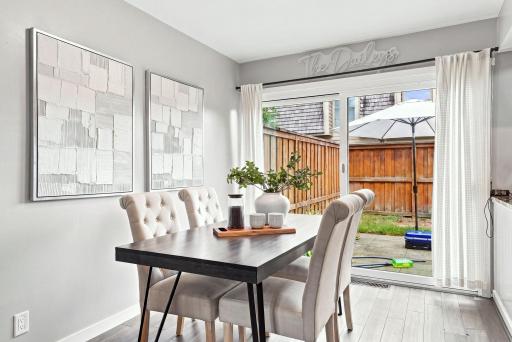 Dedicated dining space connects easily to both the kitchen and private patio.