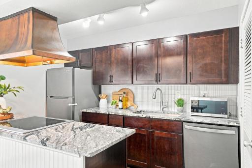 Granite countertops and updated finishes add style and function to the kitchen.